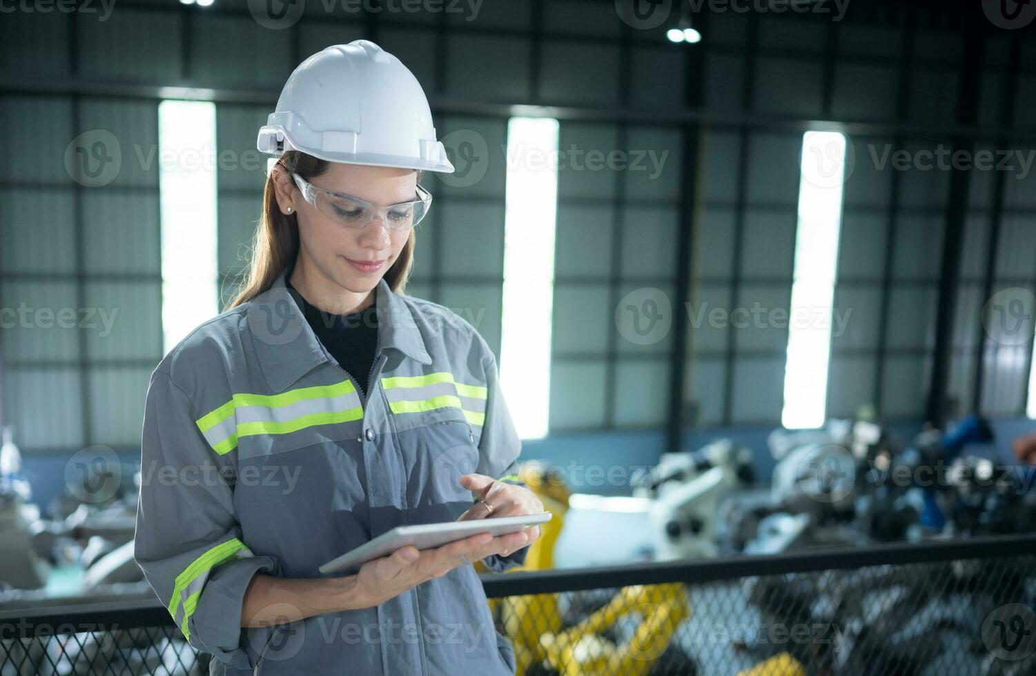 A female auditor Inspected to account for the company's robot assets that were brought to the warehouse before delivering to customers. photo