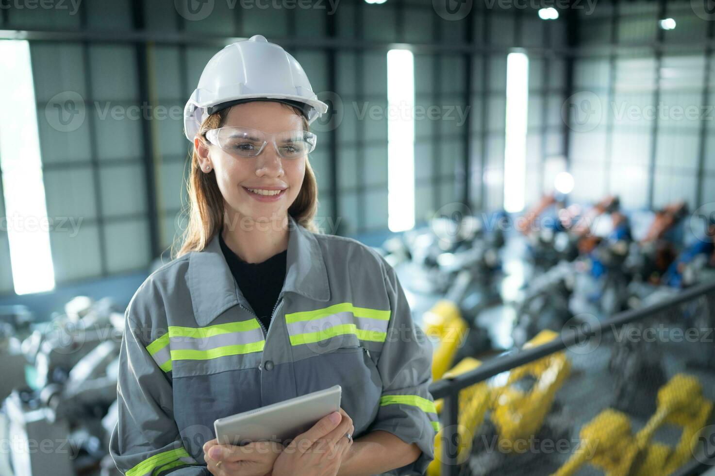 A female auditor Inspected to account for the company's robot assets that were brought to the warehouse before delivering to customers. photo