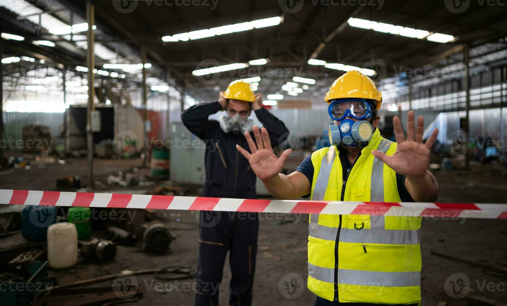 Restricted area, officials employ white and red stripes to block the area where a chemical leak is occurring. To prevent individuals from coming into contact with potentially dangerous chemicals, photo