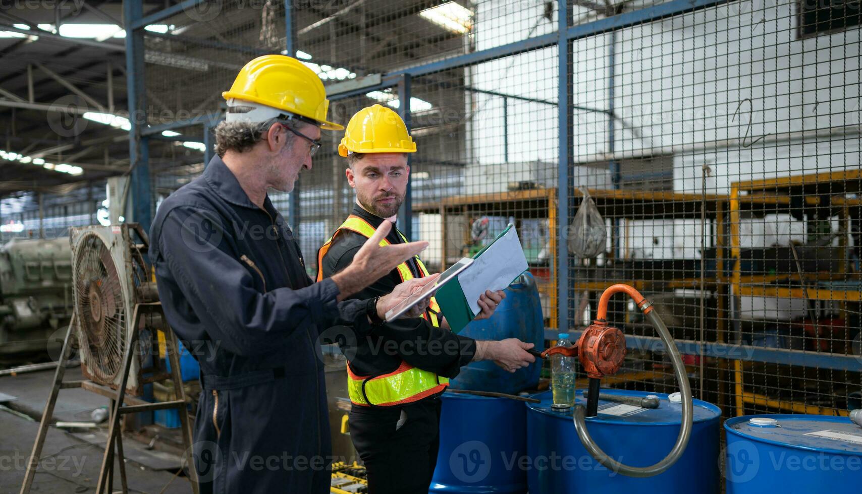 Technician and engineer inspecting and measuring the engineering values of oils to be used in the machinery industry. photo