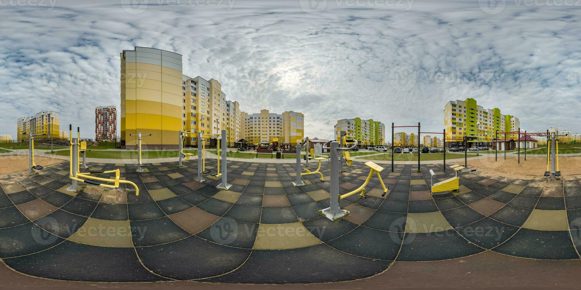 360 hdri panorama view outdoor exercise equipment gym among modern residential complex with skyscrapers and high-rise buildings in equirectangular spherical projection ready VR virtual reality content photo