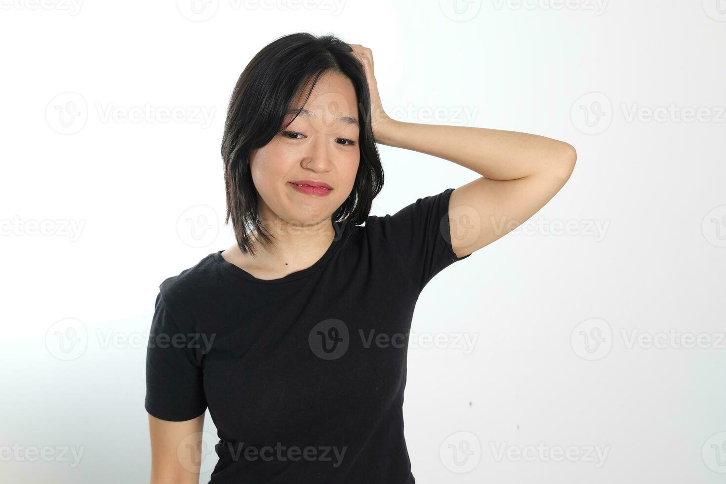 Young attractive south east asian woman pose face expression emotion on white background hand head happy photo