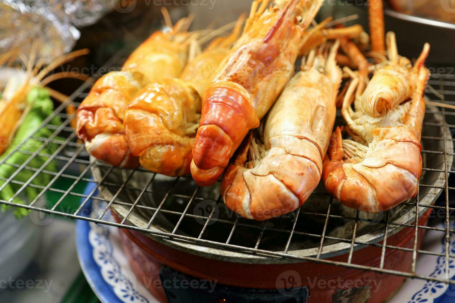 Fresh prawn shrimp BBQ grill at street side food stall photo