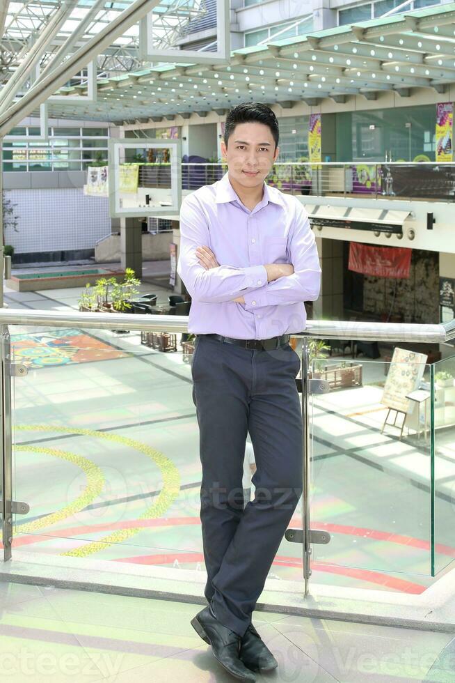 Young south east Asian middle eastern man woman business colleague outdoor stand pose photo