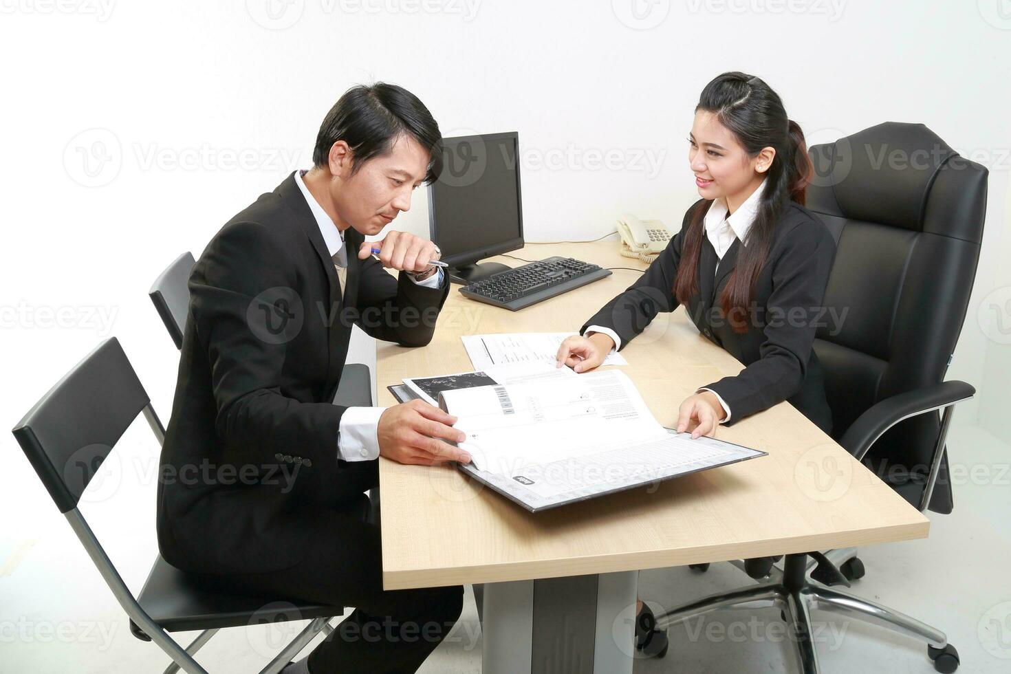 Young Asian man woman wearing business office suit chair table computer white background photo