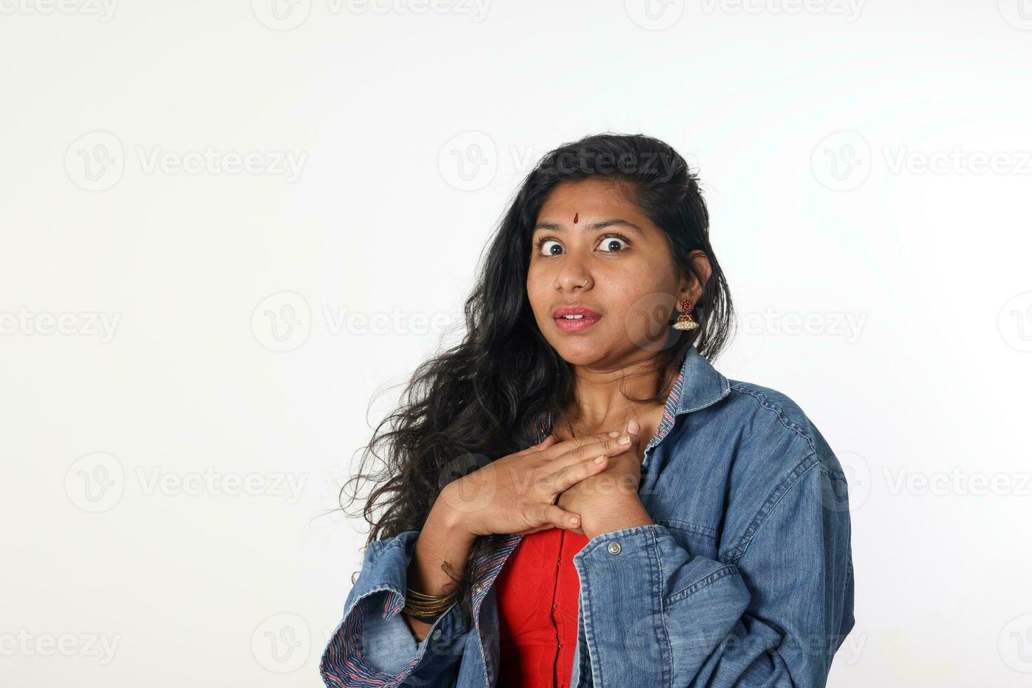Young attractive Asian Indian woman pose face body expression mode emotion on white background shocked surprised scared photo