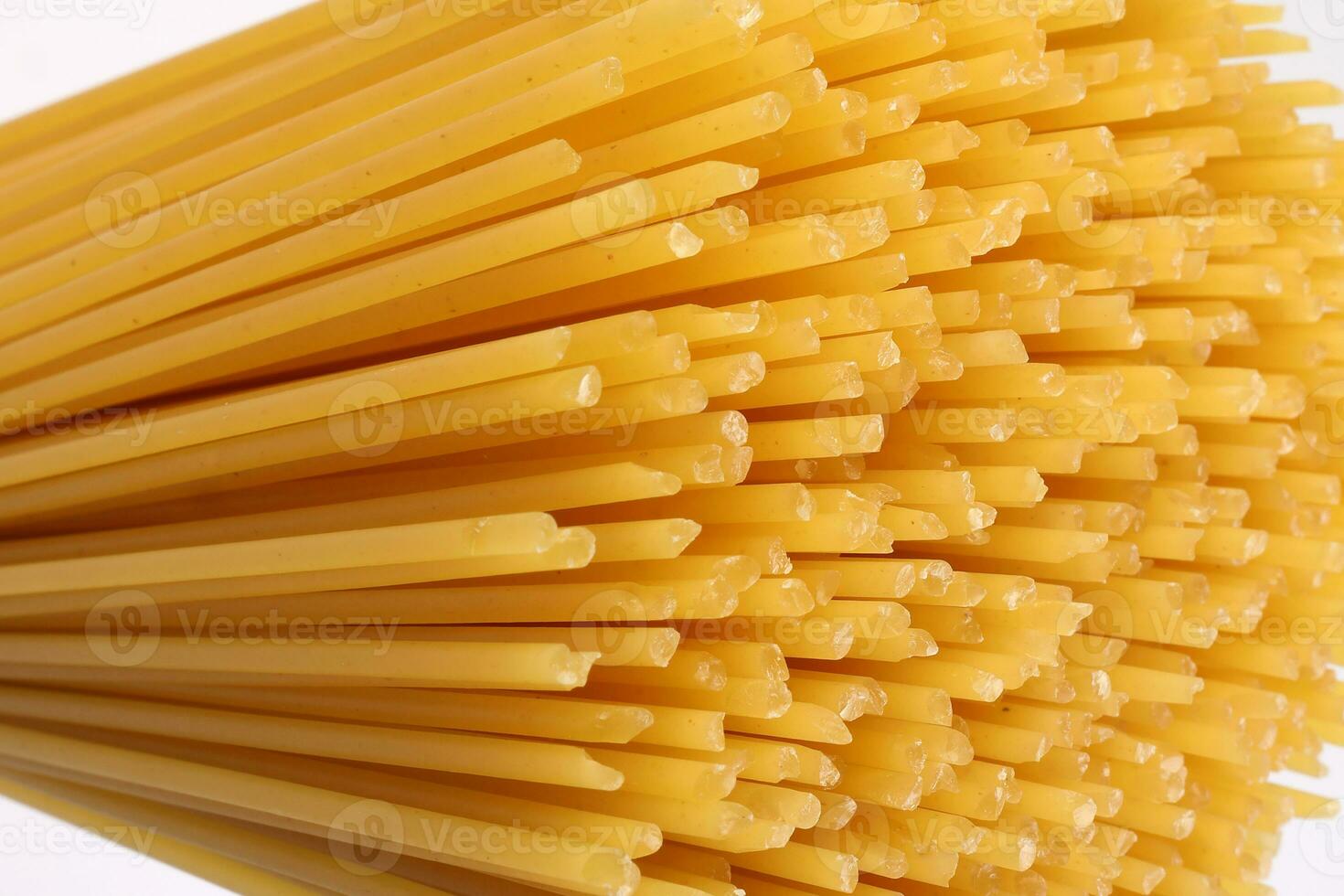 dry raw spaghetti white background blooming flower sunray glow pattern concept macro closeup photo