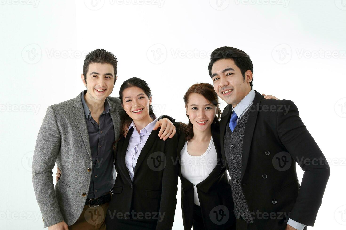 Southeast Asian middle eastern Caucasian young office business man woman wearing suit stand hand on shoulder unity togetherness confident happy success expression on white studio background photo