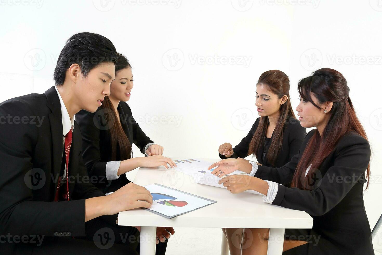 South East Asian young Malay Chinese Indian man woman wearing formal business office ware on white background sit at meeting table talk disuses study file project gruff photo