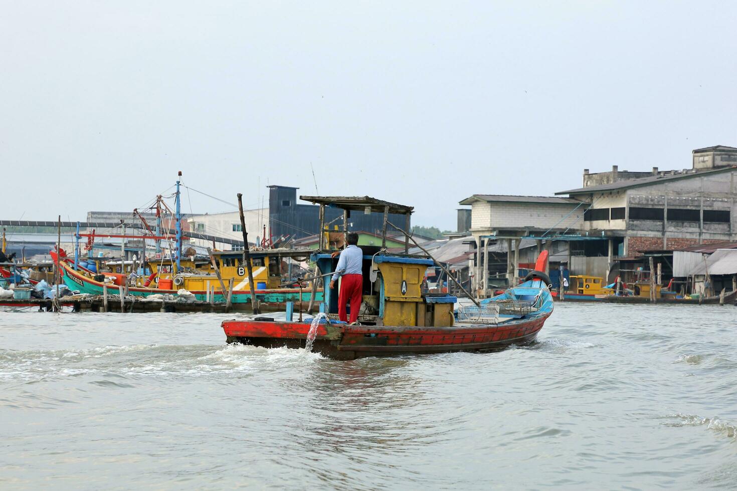Taiping, Malaysia- August 18, 2019-Kuala Sepetang, formally known as Port Weld is a vibrant fishing village, popular tourist destination. Visiting charcoal factory, pink dolphin, eagle feeding etc, photo