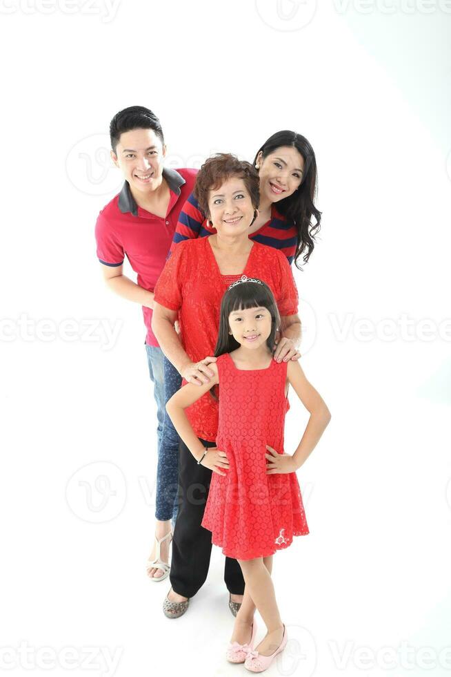 Southeast Asian multigeneration family parents daughter grandmother father mother child pose happy sit stand photo