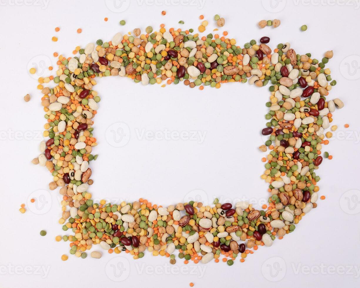 Mixed beans multi grain colorful mixture frame border copy text space on white background photo