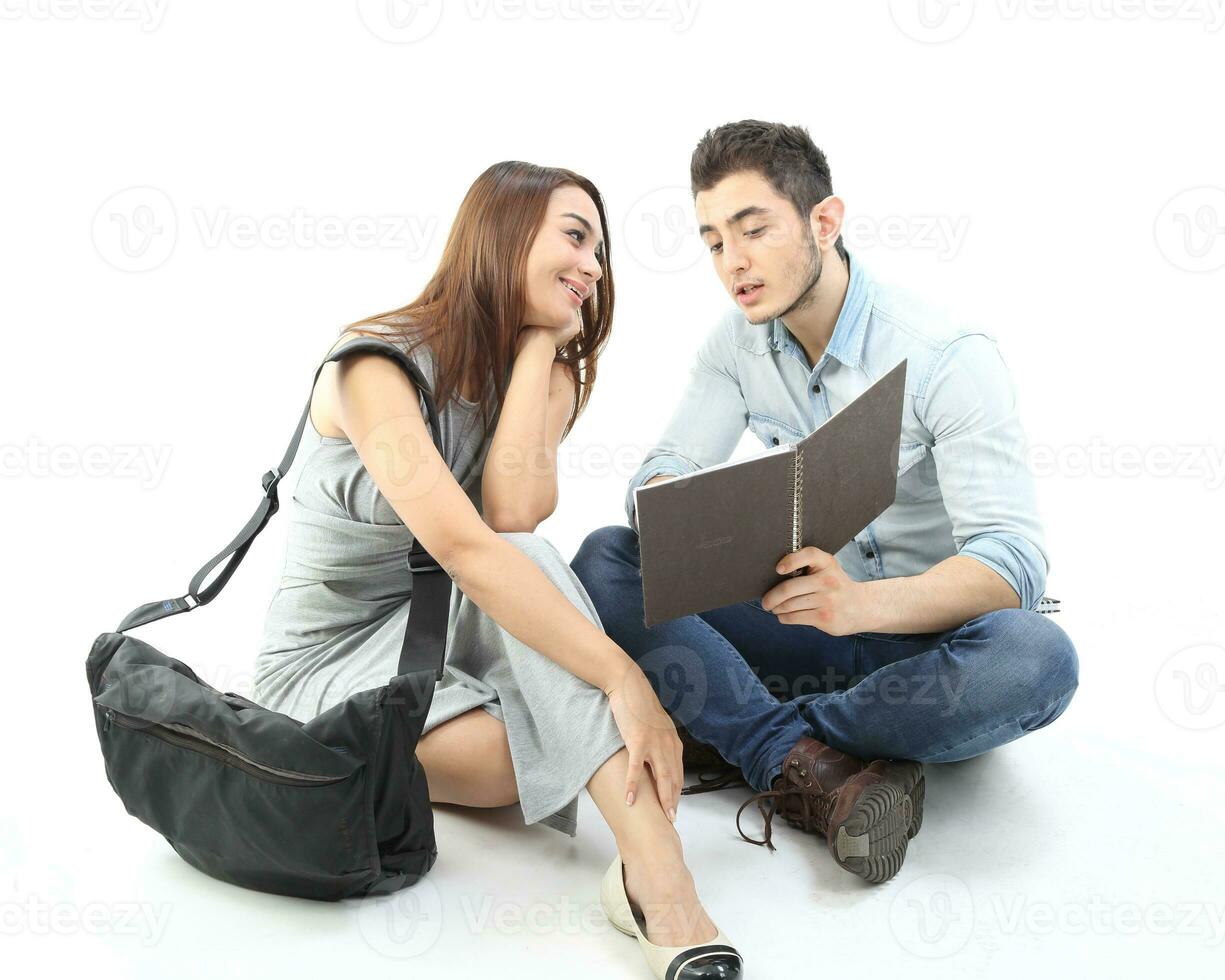 Yong south east Asian middle eastern Caucasian youth man woman in casual dress walk talk fun sit at table book notebook pen laptop computer study think read on white background photo