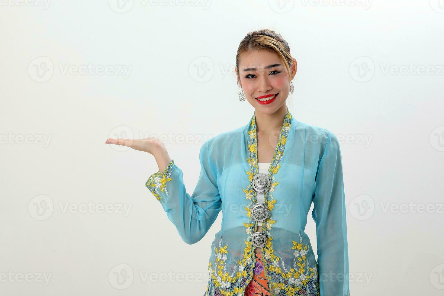 Asian woman traditional blue orange kebaya sharong on white  background hand palm show display photo
