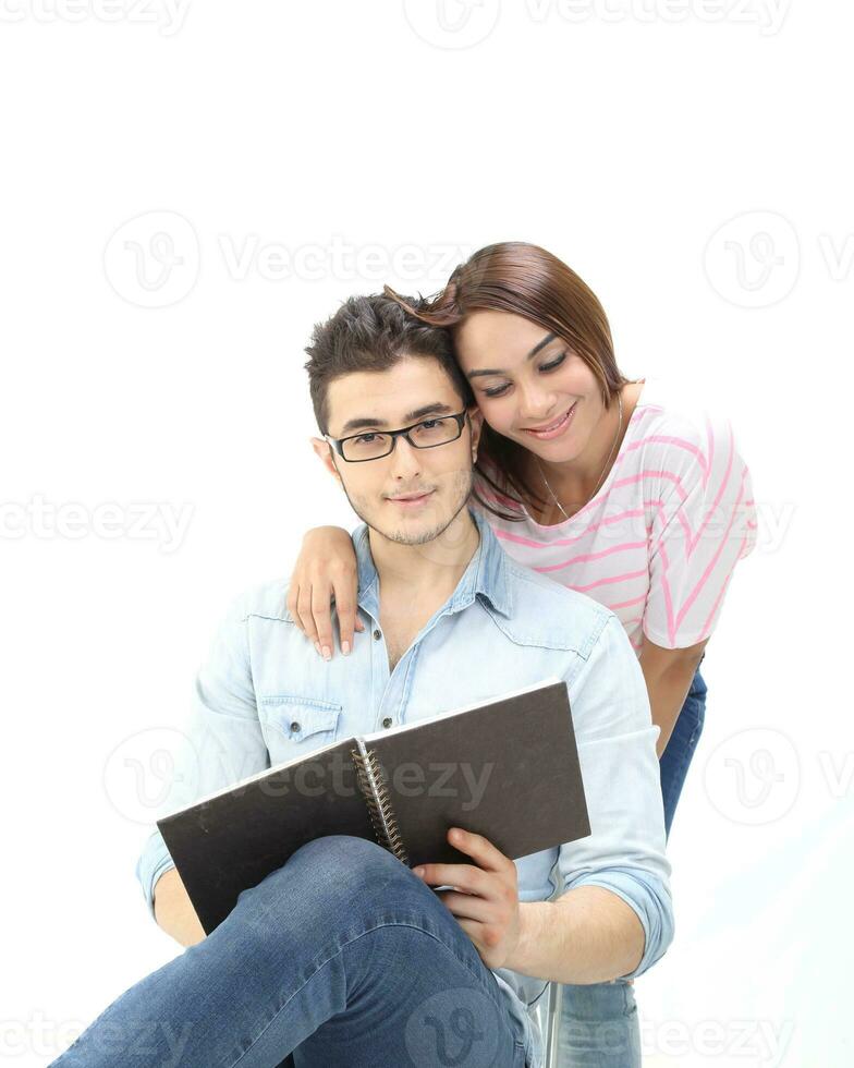 Yong south east Asian middle eastern Caucasian youth man woman in casual dress walk talk fun sit at table book notebook pen laptop computer study think read on white background photo