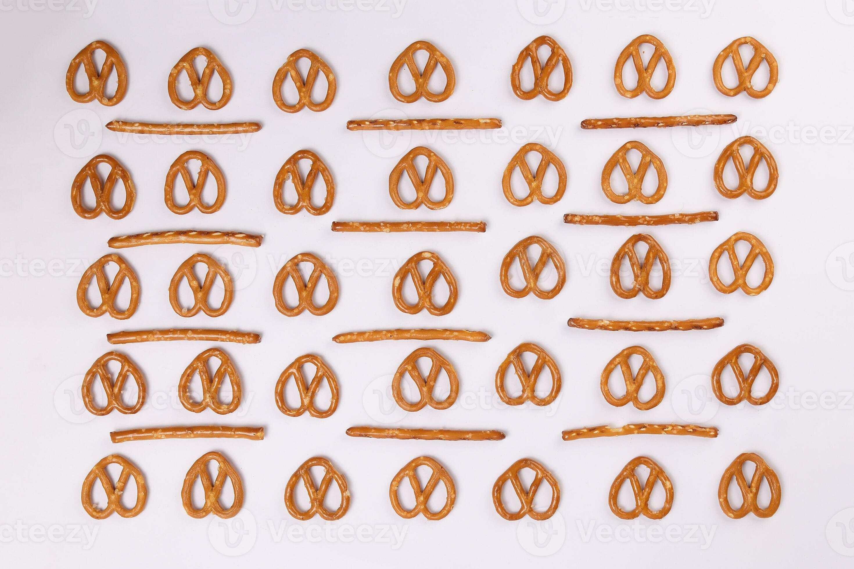 Pretzel cracker sticks laid in rows design angle straight on what