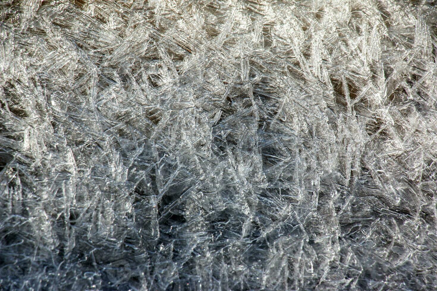 Ice surface of the river. Texture of ice shards. Winter background. photo