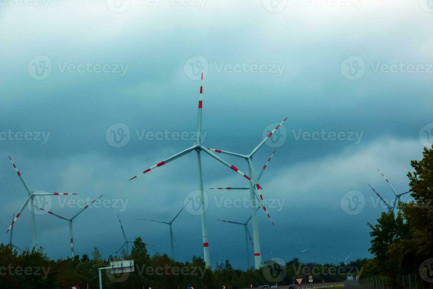 Wind farm or windmill in cloudy weather in Austria in Europe, allows you to get clean energy. It's sustainable, renewable energy for the environment photo