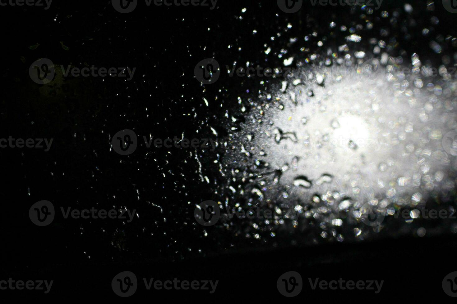 Lens flare effect with wet drop on black background. Overlay, effects sunlight, light leaks photo