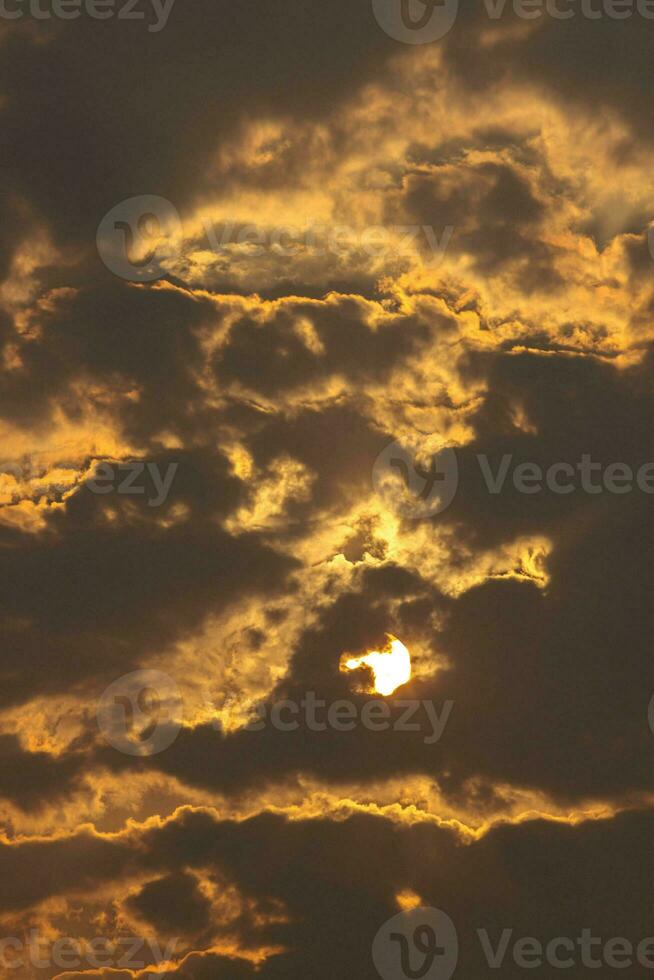 sun was behind the clouds in the evening, causing the light to scatter and the splashes of nature to create a fiery and terrifying look. photo