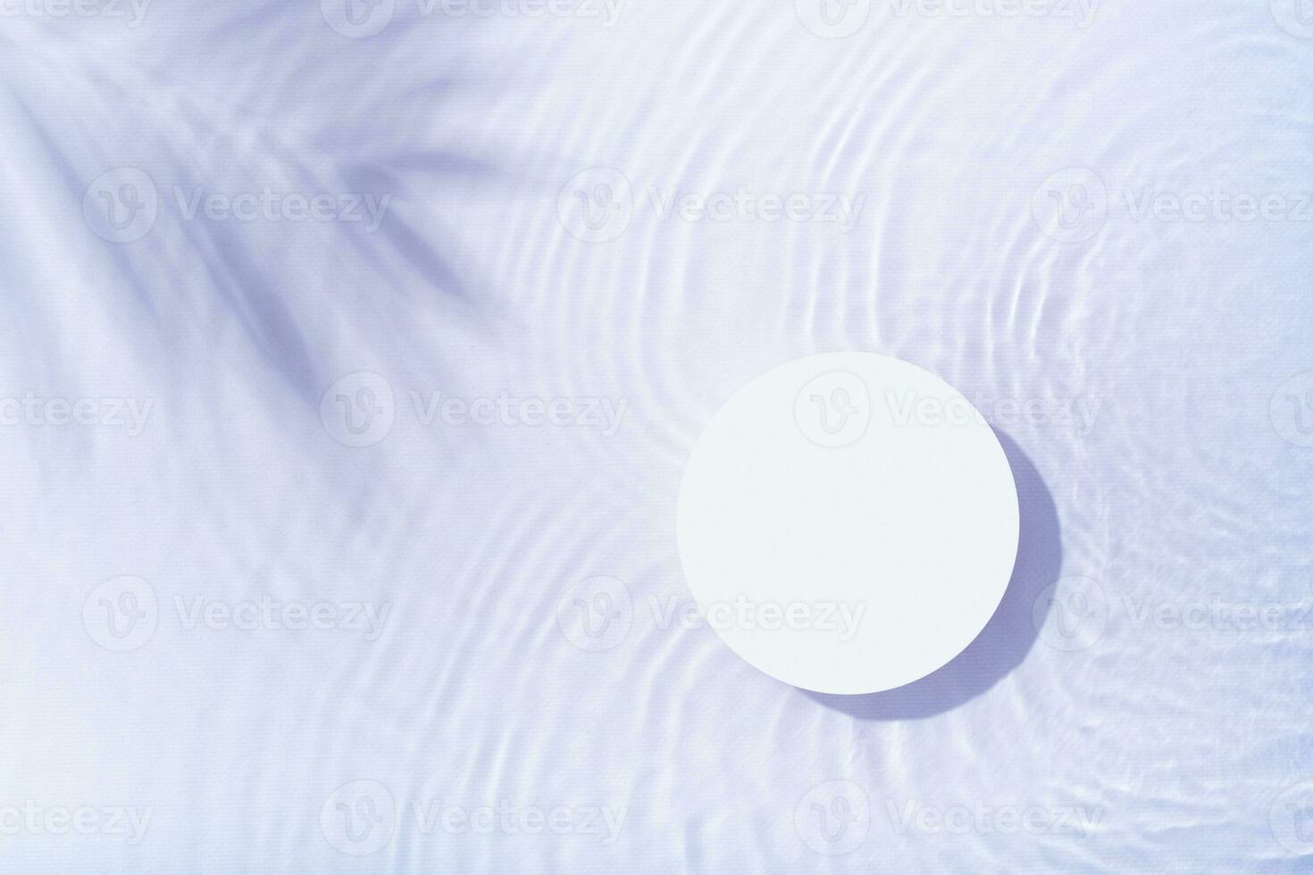 Podium or pedestal with water ripple and palm shadow flat lay, top view. Summer cosmetic template, mock up photo