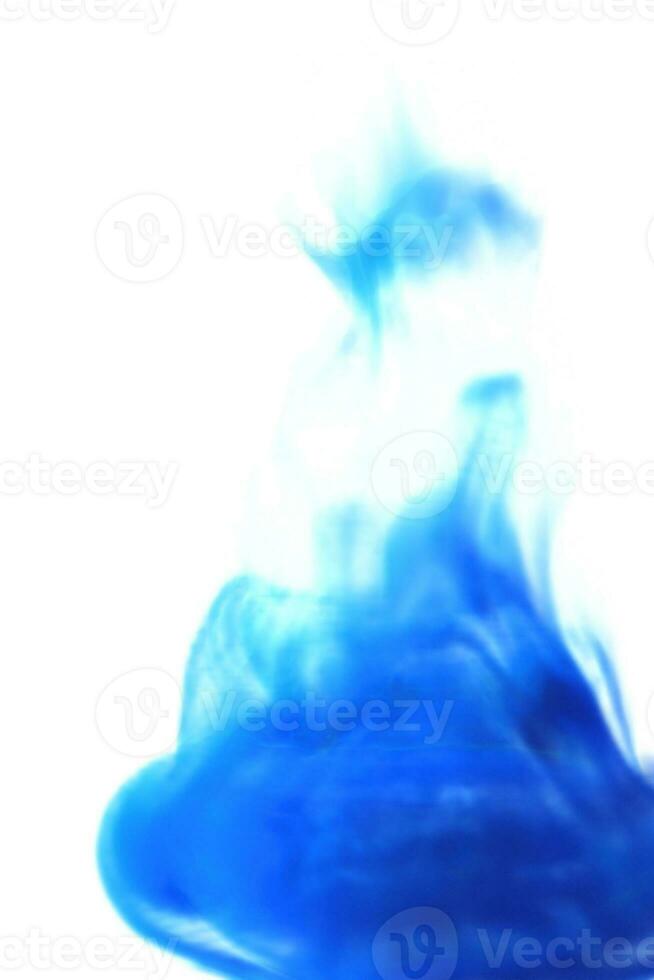 Liquid smoke ink drop effect blue on white background photo