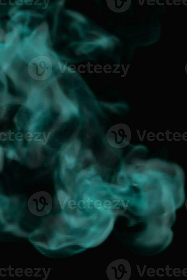 Liquid smoke ink drop effect on dark background photo
