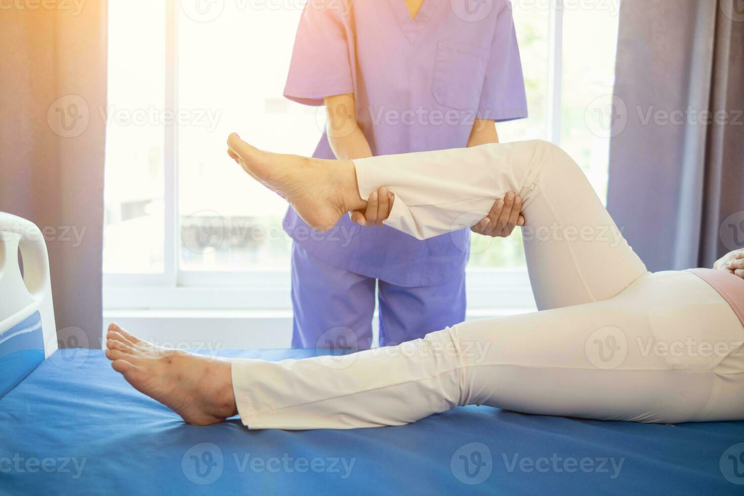 Physical therapists are helping elderly people to take care of themselves after a long period of recovery and they need regular physical therapy to help their bodies recover. physical therapy concept photo