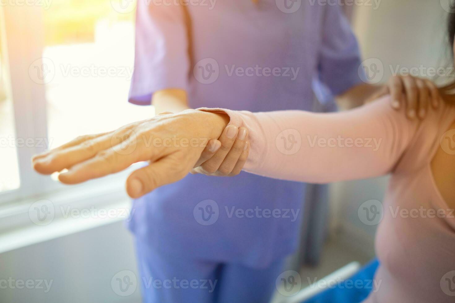 Physical therapists are helping elderly people to take care of themselves after a long period of recovery and they need regular physical therapy to help their bodies recover. physical therapy concept photo