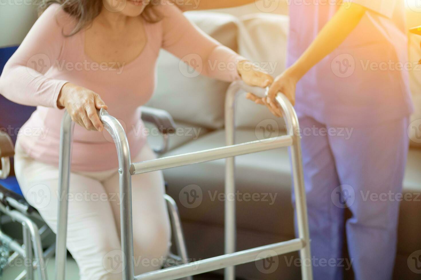 Physical therapists are helping elderly people to take care of themselves after a long period of recovery and they need regular physical therapy to help their bodies recover. physical therapy concept photo