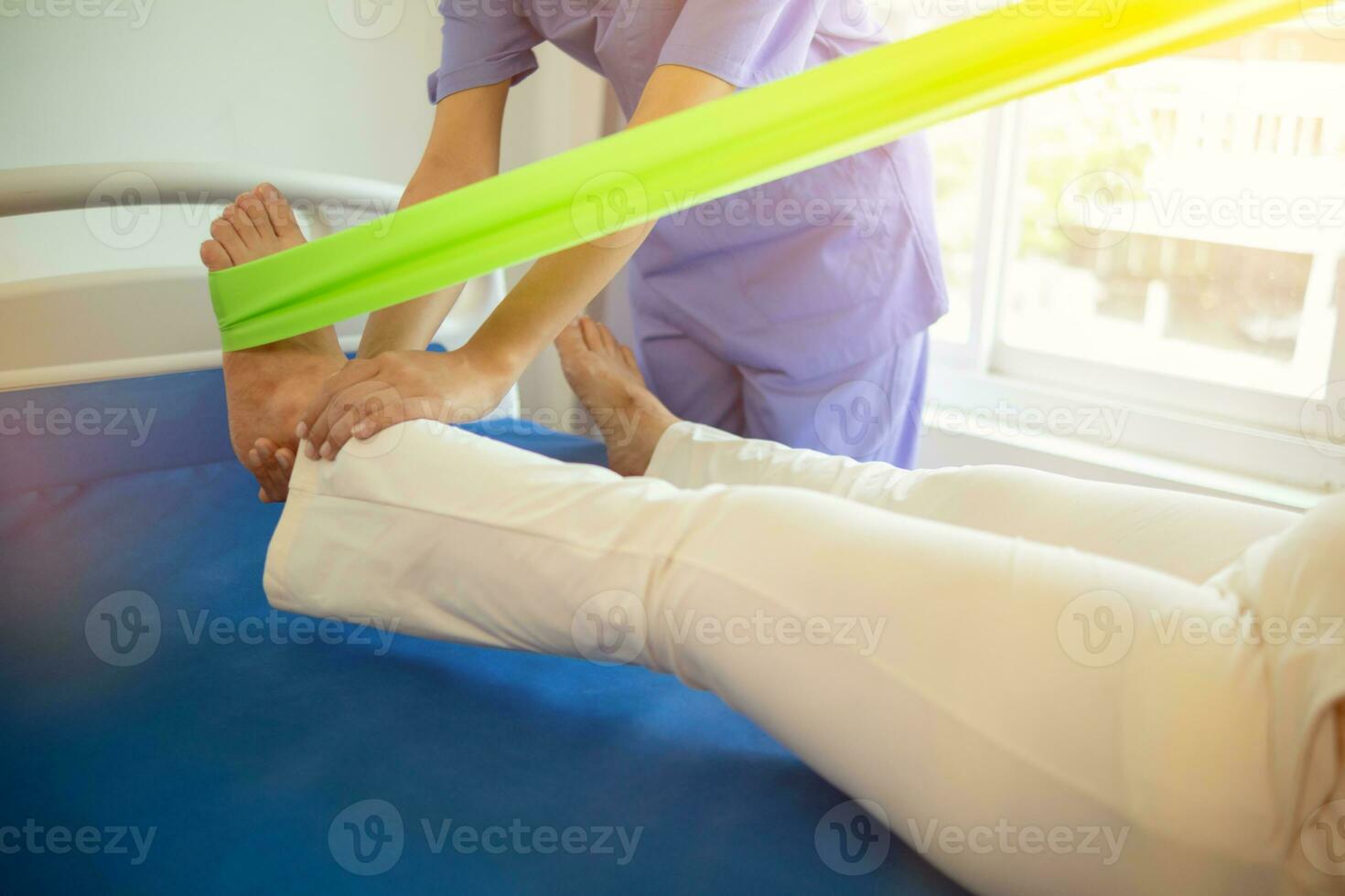 Physical therapists are helping elderly people to take care of themselves after a long period of recovery and they need regular physical therapy to help their bodies recover. physical therapy concept photo