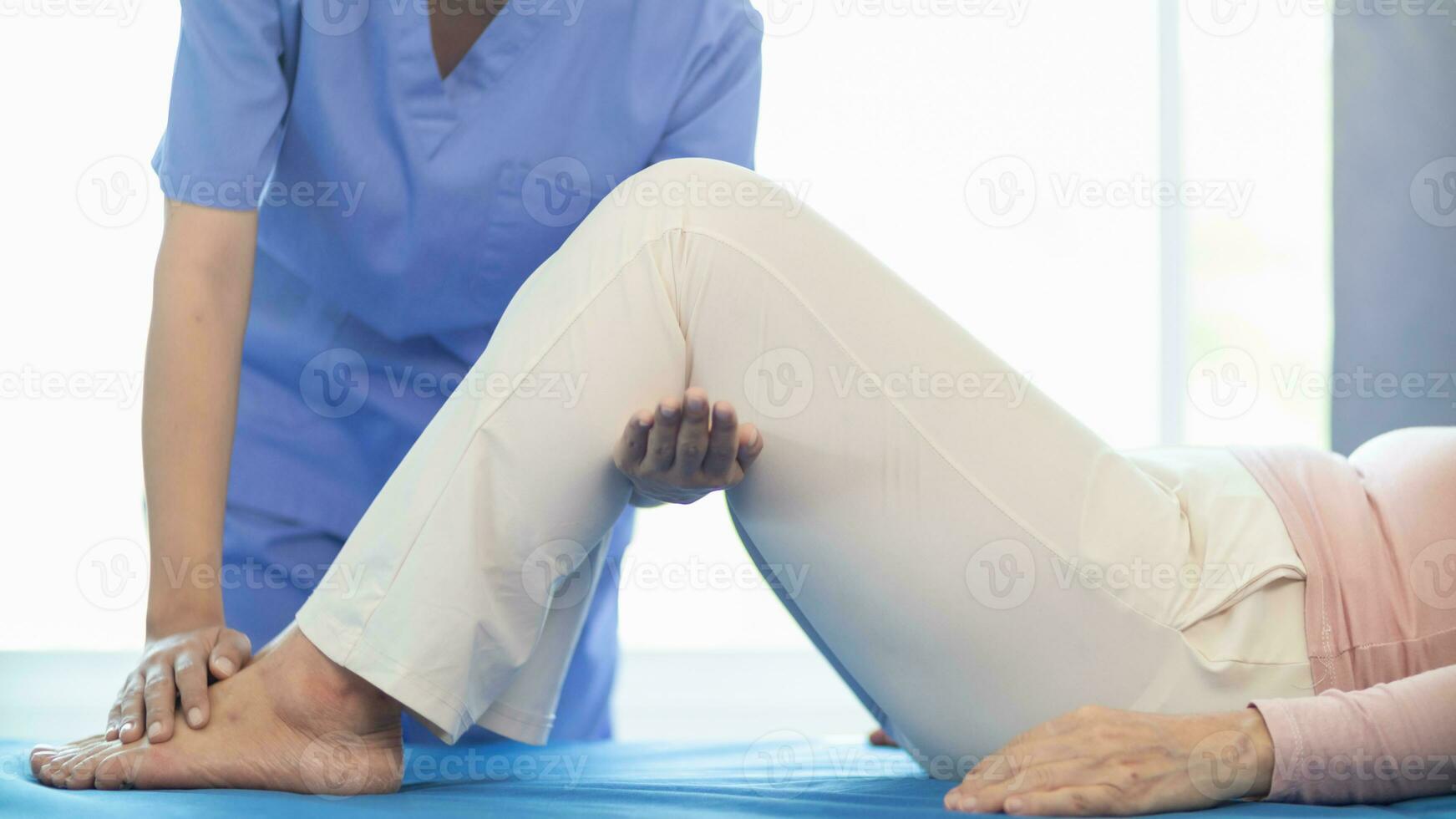 Physical therapists are helping elderly people to take care of themselves after a long period of recovery and they need regular physical therapy to help their bodies recover. physical therapy concept photo