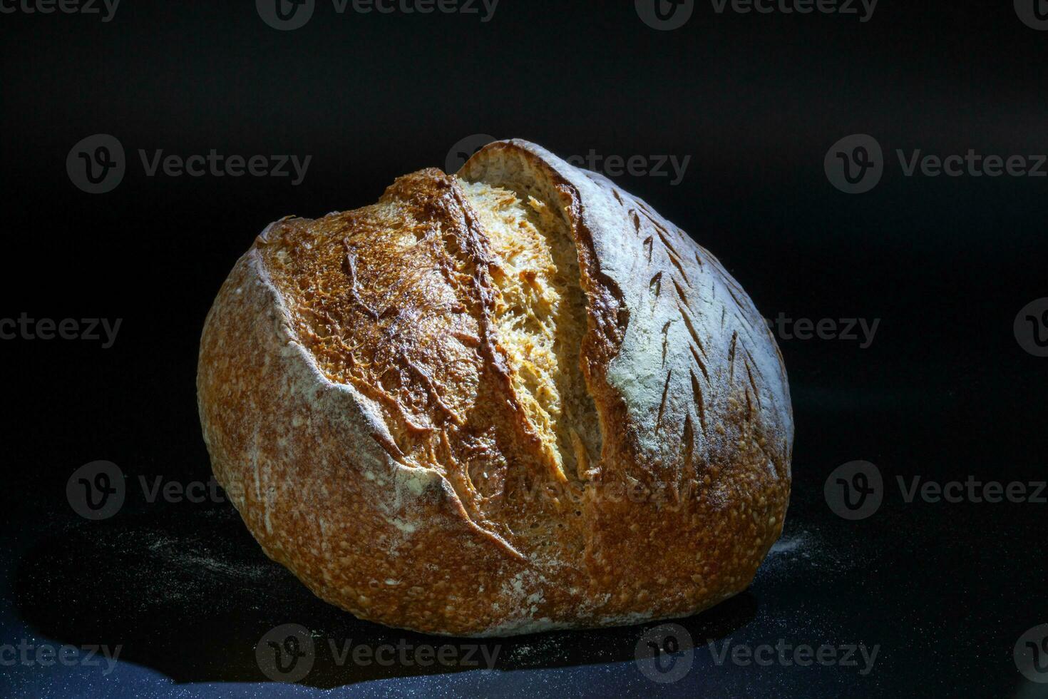 Vermont black flour rye bread with a crispy crust and a spongy texture. Freshly baked homemade bread. Photo in high quality.