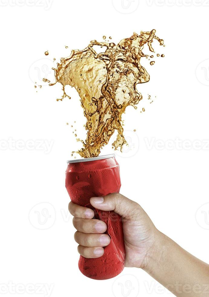 Compressed cans in hand. Cola splashing out of a red can isolated on white background photo