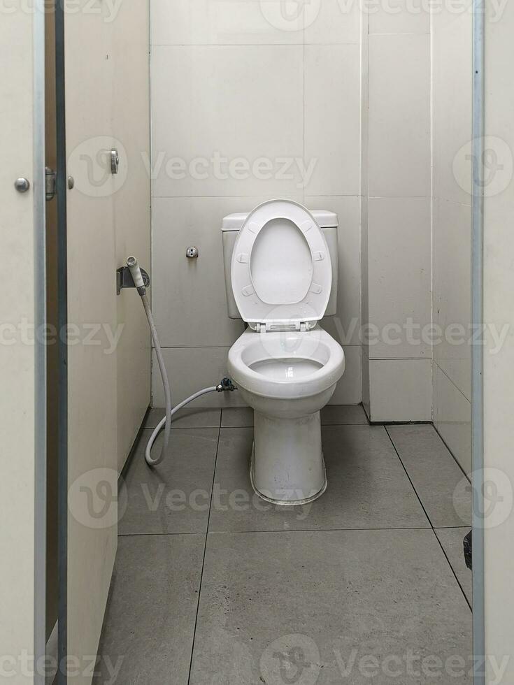 Empty white public bathroom concept photo