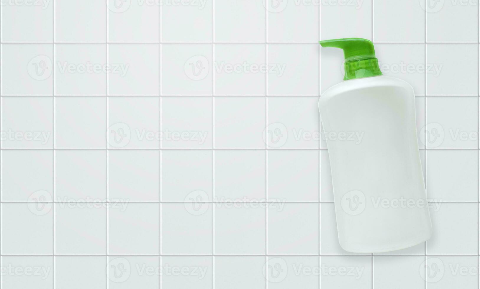 Top view Liquid soap bottle with tile background Bathroom accessories photo