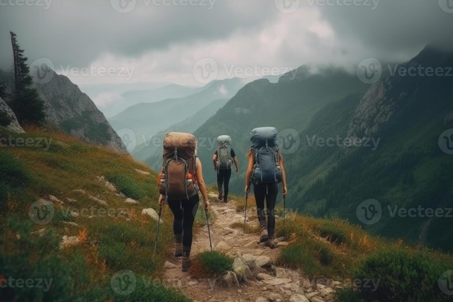 Travelers with backpacks hiking in mountains. photo