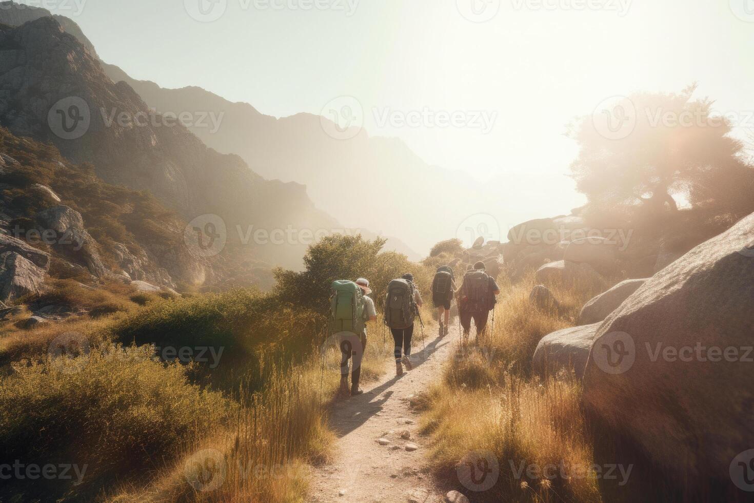 Travelers with backpacks hiking in mountains. photo