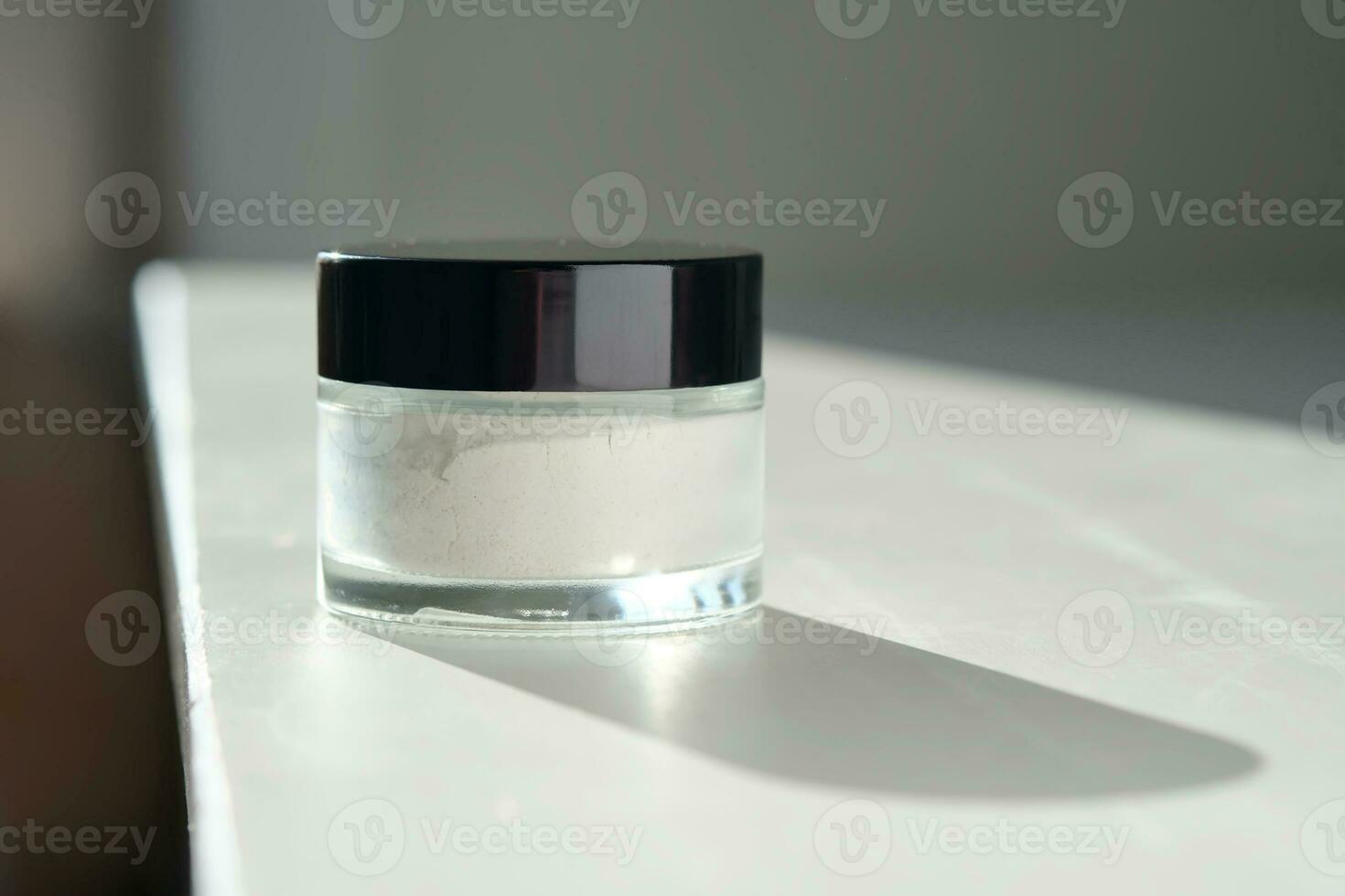 Closed jar of scrub-powder for the face. photo