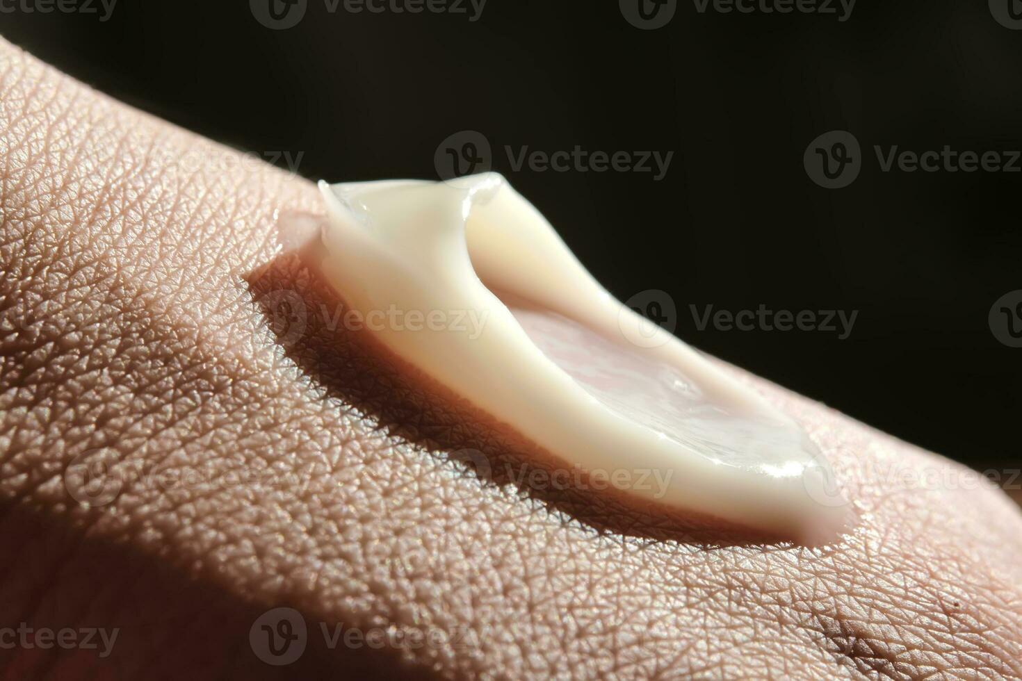 A smear of moisturizer on the hand. photo