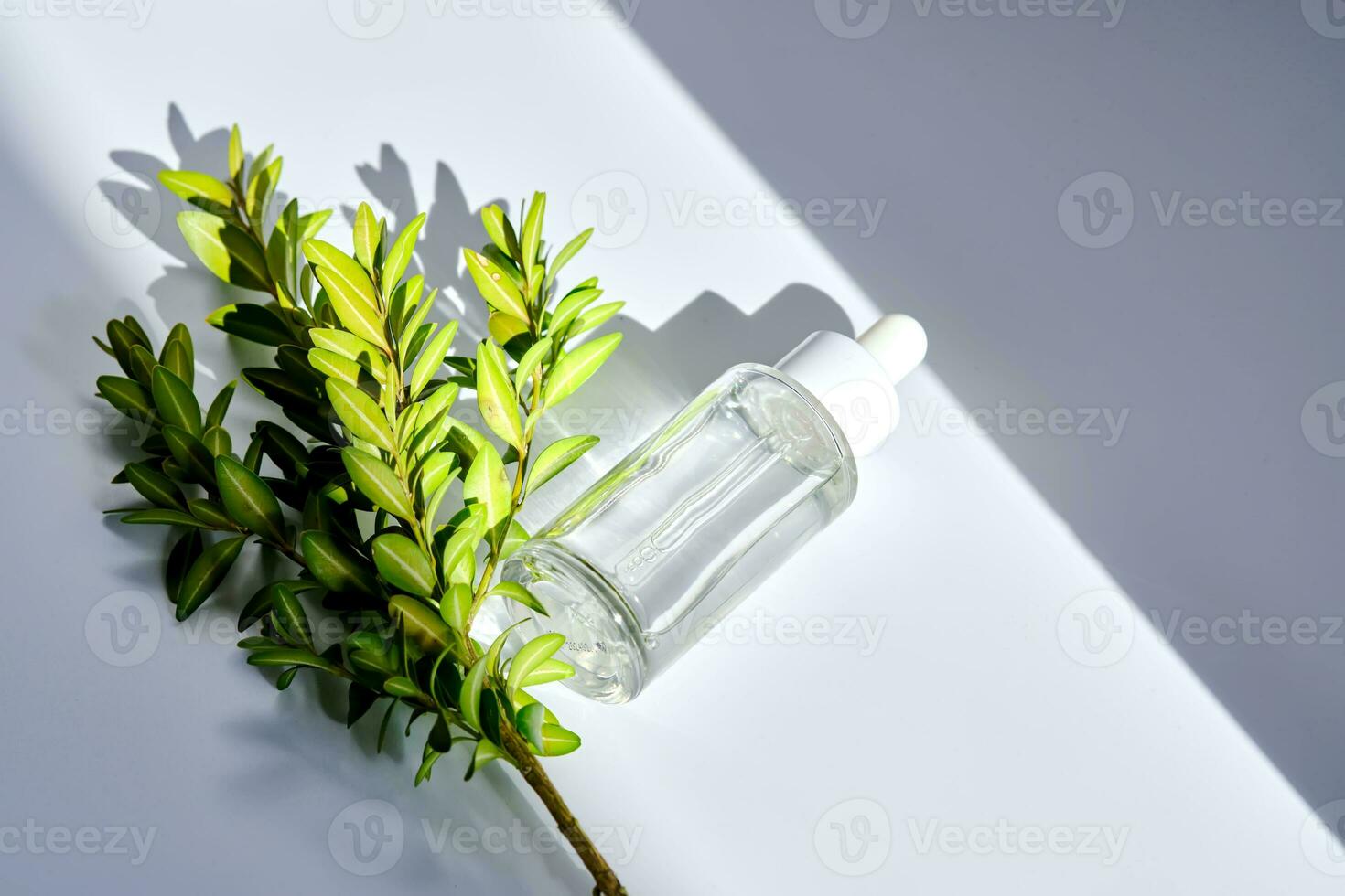 Serum with a dropper with spring flowers. photo