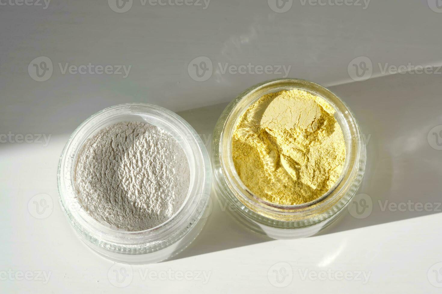 A jar of rice flour face scrub and a jar of turmeric face scrub