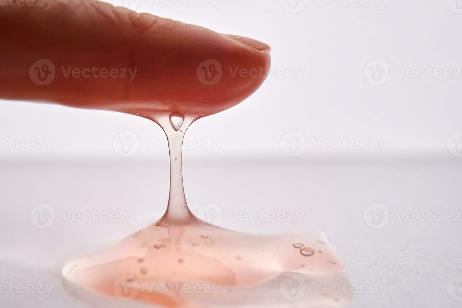 The texture of a pink viscous cosmetic. photo