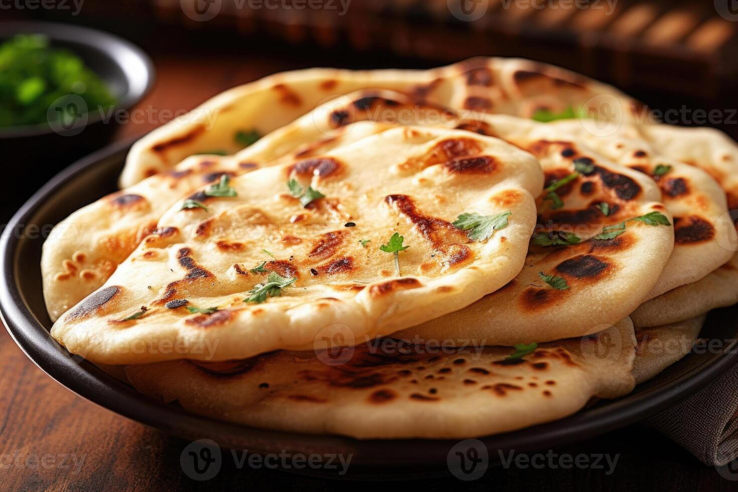 Naan bread in plate. Flatbread with spices. Indian cuisine. photo
