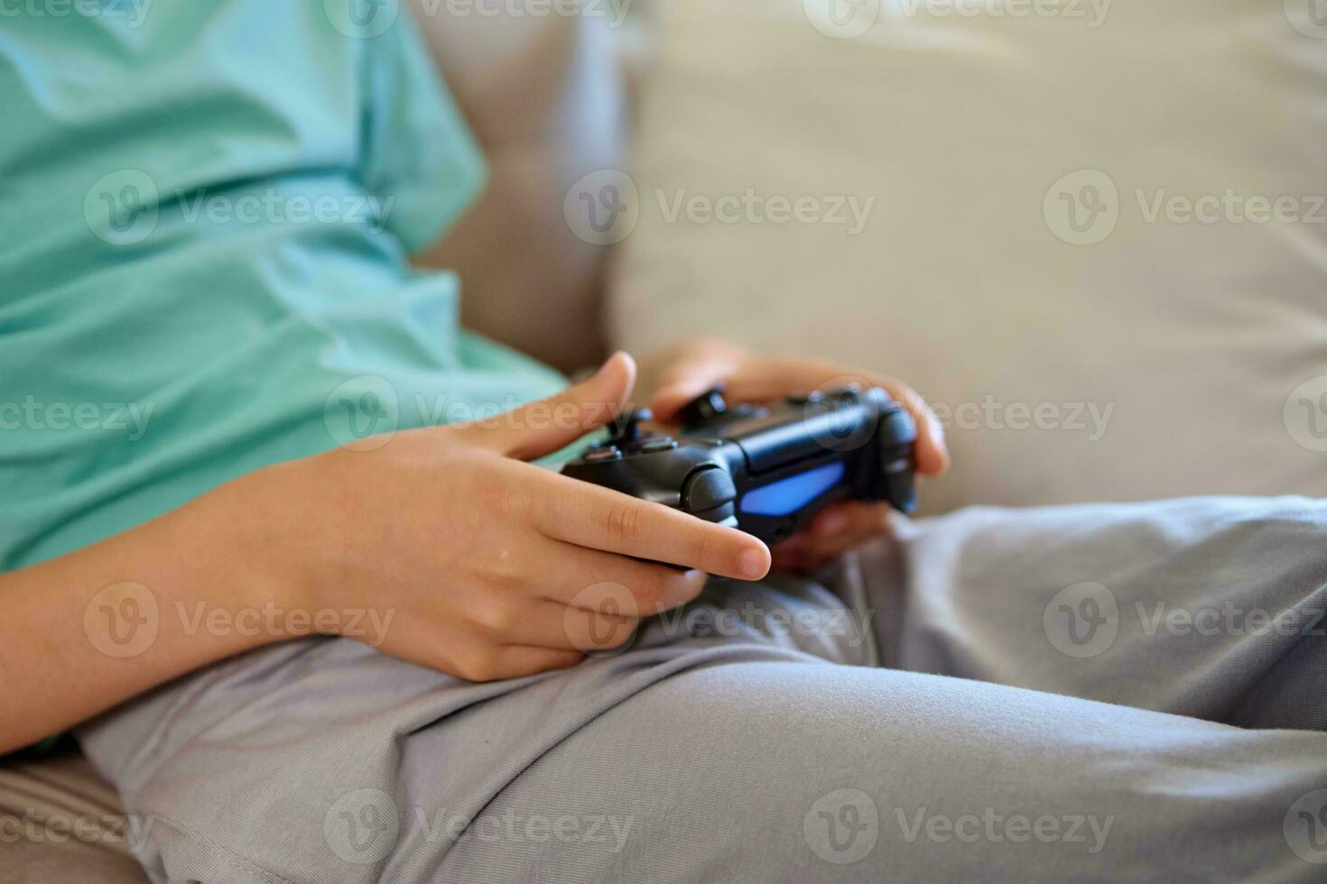 Boy play video game, use gamepad photo