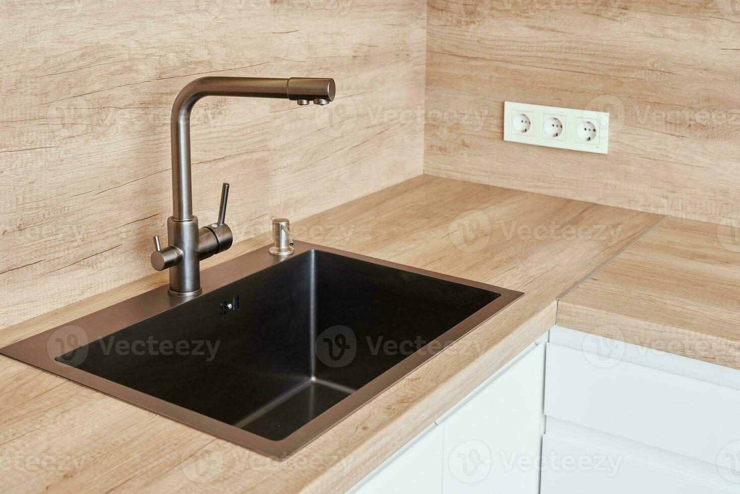 New kitchen interior with sink and mixer photo