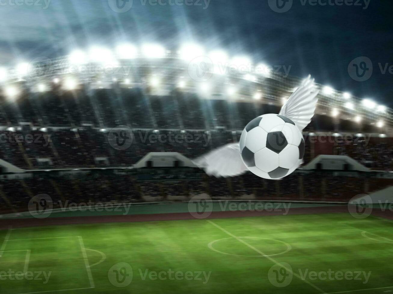 soccer ball have wings fly, soccer goal on stadium in night photo