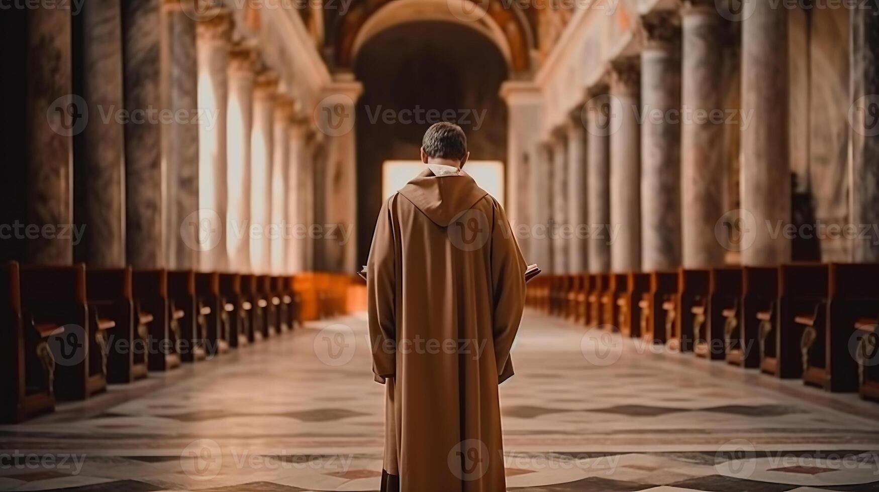 Rear view of young priest standing in the church. . photo