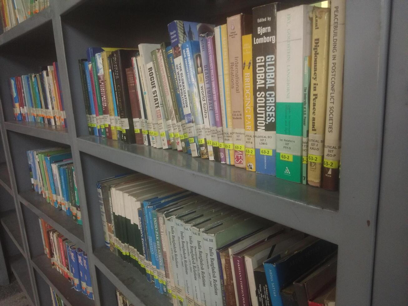 Bookshelves in the library. Large bookcase with lots of books. Library or shop with bookcases. Cozy book background. Bookish, bookstore, bookshop. photo