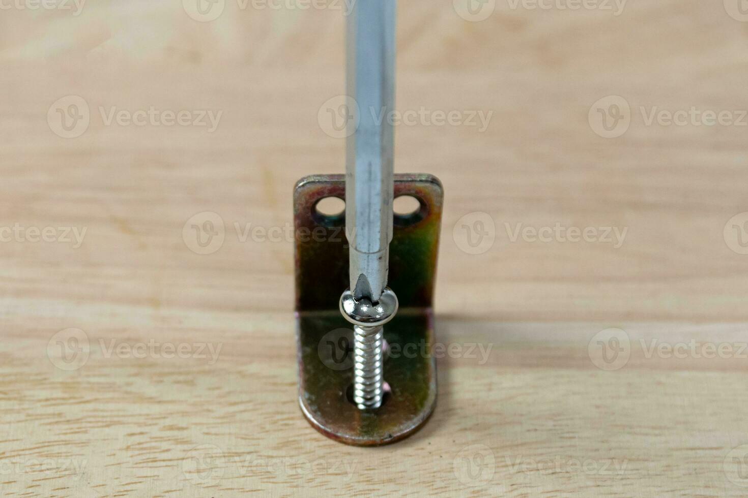 Screwdrivers and screws for drilling wood photo